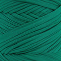 A close-up of a green yarn ball, showing the texture and color of the twisted elastic threads.