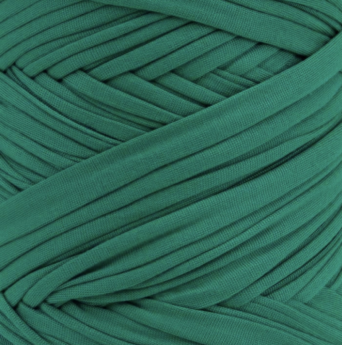 A close-up of a green yarn ball, showing the texture and color of the twisted elastic threads.